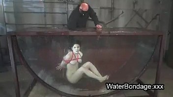 Brunette In Rope Bondage Dive In Water